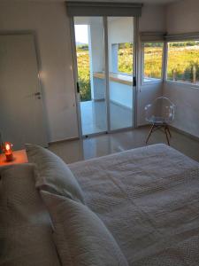 Postel nebo postele na pokoji v ubytování Barrancas Suites
