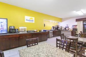 a dining room with tables and chairs in a restaurant at Days Inn by Wyndham Fond du Lac in Fond du Lac