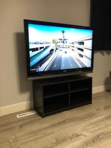 a flat screen tv sitting on a entertainment center at Niagara Falls (USA) Minutes to EVERYTHING in Niagara Falls