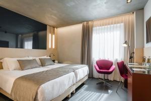 Кровать или кровати в номере Hotel Metropolis