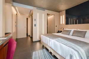 Кровать или кровати в номере Hotel Metropolis