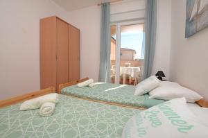 Postel nebo postele na pokoji v ubytování Apartment Marija