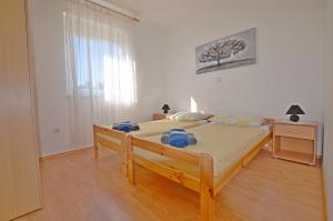 Postel nebo postele na pokoji v ubytování Apartment Marija
