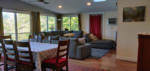 a living room with a table and a couch at Lake side oasis in Freedom