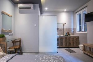 a room with a bed and a bathroom with a sink at A4k Mua at Ubud in Ubud +12 photos
