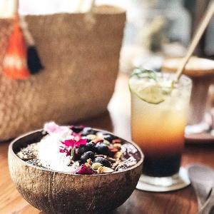 a bowl of food on a table with a drink at 被愛咖啡小旅館 Birdeye Garden in Tainan
