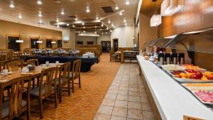 a restaurant kitchen filled with lots of food at Best Western Plus Winnipeg Airport Hotel in Winnipeg