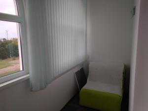 Cama o camas de una habitación en Omega City Apartments