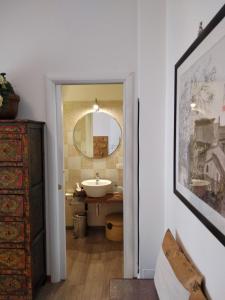 a bathroom with a sink and a mirror at B&B Orchard in Viterbo