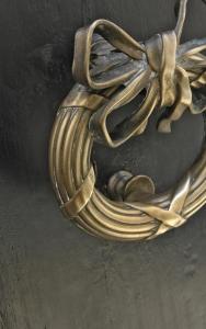 a gold bracelet with a fish and a shell at L'Hôtel Particulier in Arles