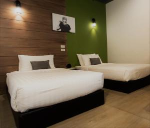Cama o camas de una habitación en The Rodman Hotel