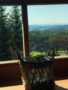 a basket sitting on a table in front of a window at Ferienhaus Schusterhof in Bergen +4 photos