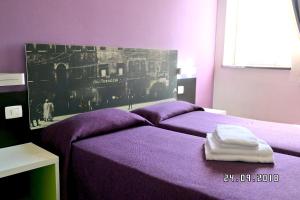 Postel nebo postele na pokoji v ubytování Hotel Mondial