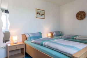 Postel nebo postele na pokoji v ubytování Ferienwohnung Zetzl