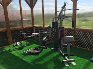 a gym with a person laying on the floor at Villa Eden DeLux in Yanoshi