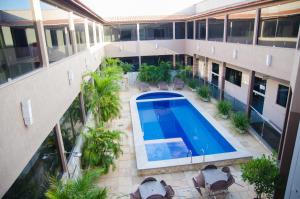 an overhead view of a building with a swimming pool at Vitoria Palace Hotel in Mossoró