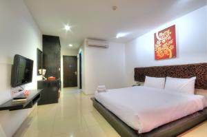 מיטה או מיטות בחדר ב-BS Residence Suvarnabhumi - SHA Extra Plus