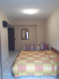 A bed or beds in a room at Lo Scoiattolo