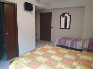 A bed or beds in a room at Lo Scoiattolo