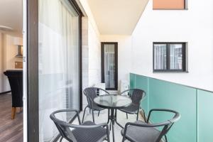 Posedenie v ubytovaní Corvin Residence Apartments