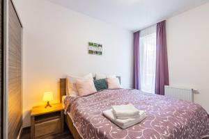 Posteľ alebo postele v izbe v ubytovaní Corvin Residence Apartments
