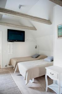 Кровать или кровати в номере Mullbärsgårdens Bed and Breakfast