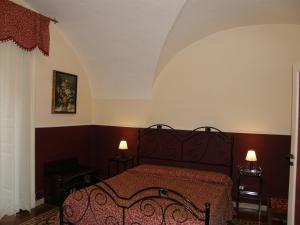 A bed or beds in a room at Il Gattopardo House