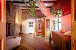Postel nebo postele na pokoji v ubytování B&B dei Papi Boutique Hotel