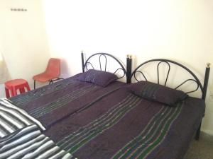 Postel nebo postele na pokoji v ubytování Stay Goa Guesthouse