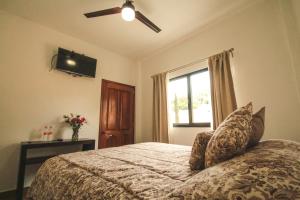 Säng eller sängar i ett rum på Posada Hacienda Real
