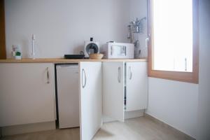 Una cocina o zona de cocina en Apartamentos Turísticos La Casa Vieja