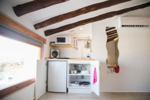 Una cocina o zona de cocina en Apartamentos Turísticos La Casa Vieja