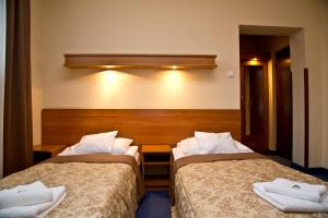 
Łóżko lub łóżka w pokoju w obiekcie Fian - noclegi i konferencje w centrum
