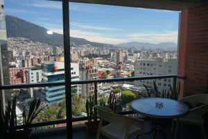 a view of a city from a balcony at Vega Apartment for Rent in Quito