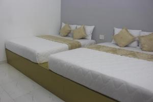 Postel nebo postele na pokoji v ubytování Phuc Hau Hotel