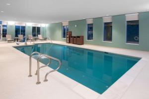 a large swimming pool in a building at Hyatt Place Westminster Denver in Westminster