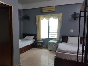 Кровать или кровати в номере Luna's House Hostel