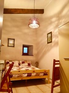 Una cama o camas en una habitación de Gîte L'Abert