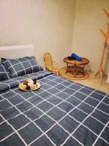 a bedroom with a bed with a tray of food on it at Sweet Homestay Penang in Bayan Lepas