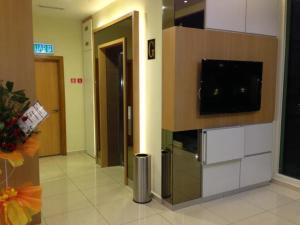 En tv och/eller ett underhållningssystem på Caspari Hotel