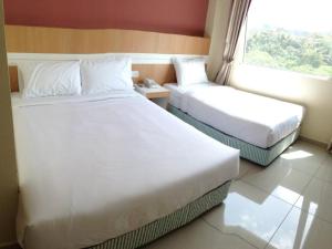 Postel nebo postele na pokoji v ubytování Caspari Hotel