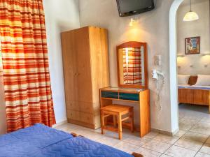 A bed or beds in a room at Hotel Helena