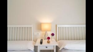 Postel nebo postele na pokoji v ubytování Kentia Rooms