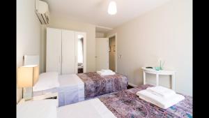 Postel nebo postele na pokoji v ubytování Kentia Rooms
