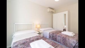 Postel nebo postele na pokoji v ubytování Kentia Rooms