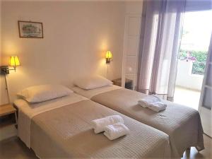 Postel nebo postele na pokoji v ubytování Stavroula Apartment