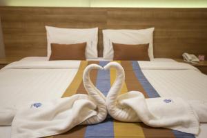 Postel nebo postele na pokoji v ubytování Unity Hotel