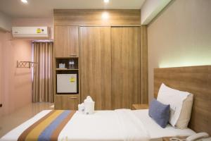 Postel nebo postele na pokoji v ubytování Unity Hotel