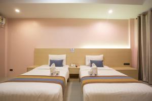 Postel nebo postele na pokoji v ubytování Unity Hotel