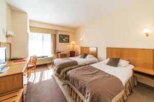 Posteľ alebo postele v izbe v ubytovaní Hotel HP Park